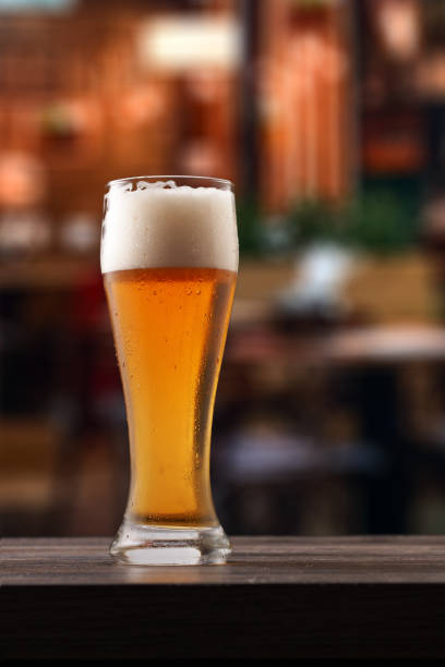 istock Glass of beer on counter in pub. 1412179865