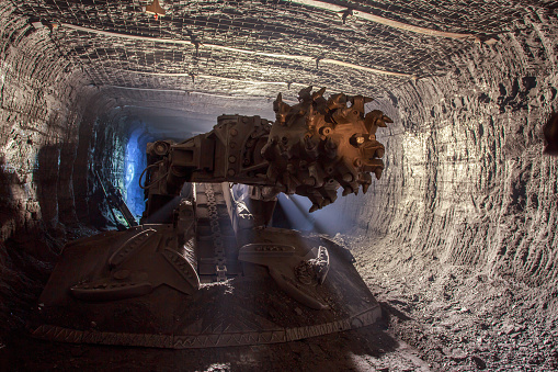 Closeup view of road header in mine. Special equipment for coal drilling.