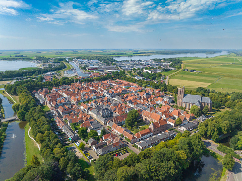 Elburg ancient walled town seen from above during a beautiful summer day in Gelderland, Netherlands. Elburg used to be a fisihing town, but now is more focussed on tourims for its location close to the Veluwemeer and Veluwe as popular tourist destinations.