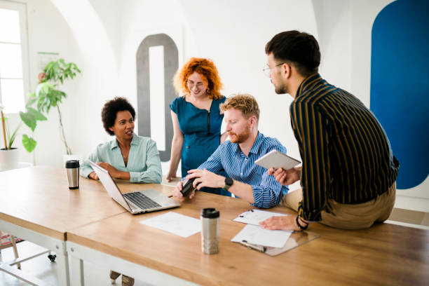 istock Successful group of businesspeople having a briefing 1412182717