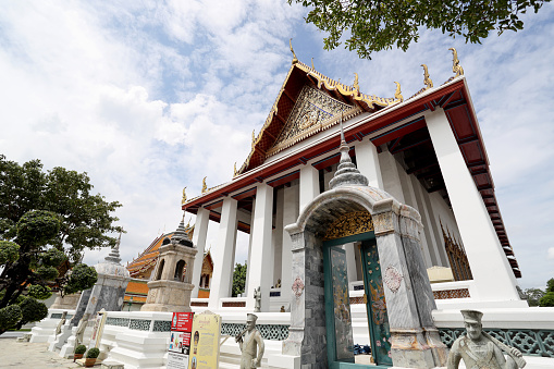 Bangkok, Thailand - July 9, 2022: Wat Suthat Thepwararam Ratchaworahawihan, the famous Buddhist temple in Bangkok Thailand.