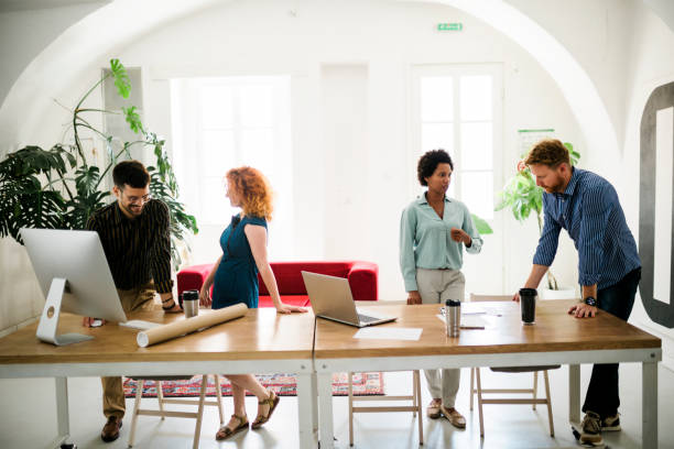istock Successful group of businesspeople having a briefing 1412183022