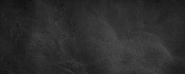 istock Black or dark gray rough grainy stone texture background 1412183832