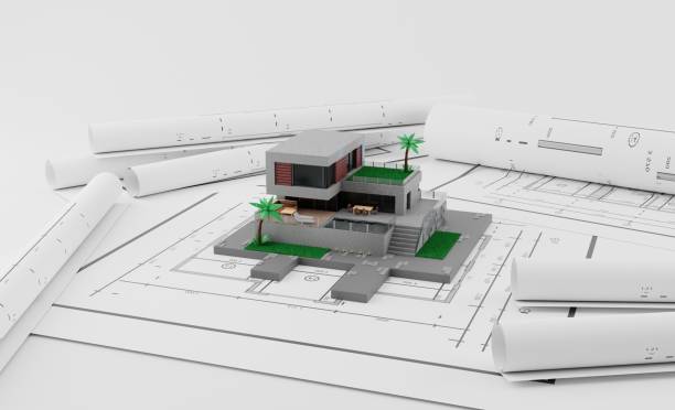 istock A model house on blueprints with equipment architect.3D rendering 1412187296