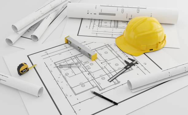 istock A model house on blueprints with equipment architect.3D rendering 1412187442