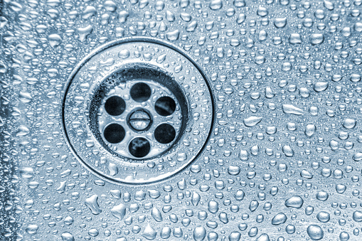 Kitchen sink covered with water droplets