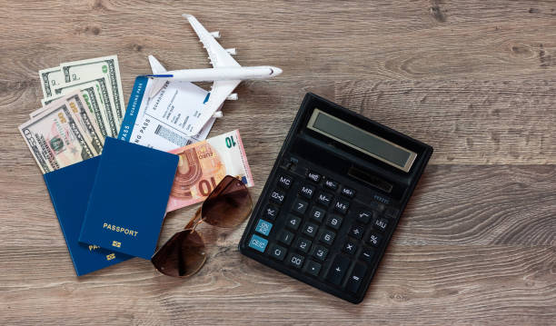istock Passport with airplane, calculator. Travel concept 1412189855