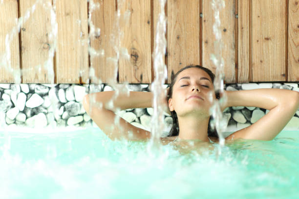 istock Woman relaxing with arms on head in a spa 1412189955
