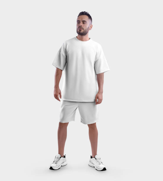 istock White suit mockup, oversized t-shirt, shorts on a guy in sneakers, front view, isolated on background. 1412189981