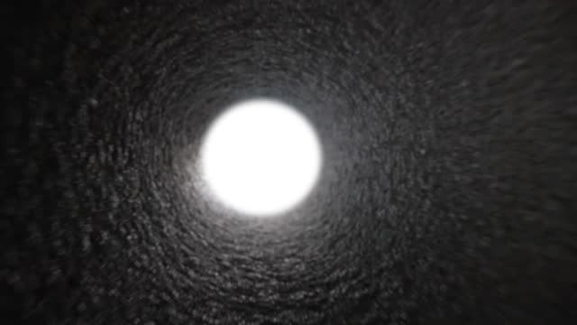 White bright light in gray tunnel or sewer.