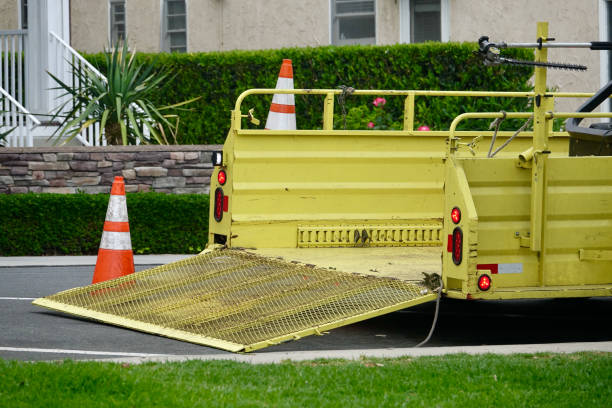 istock Trailer with lowered tailgate for landscaping equipment 1412190182