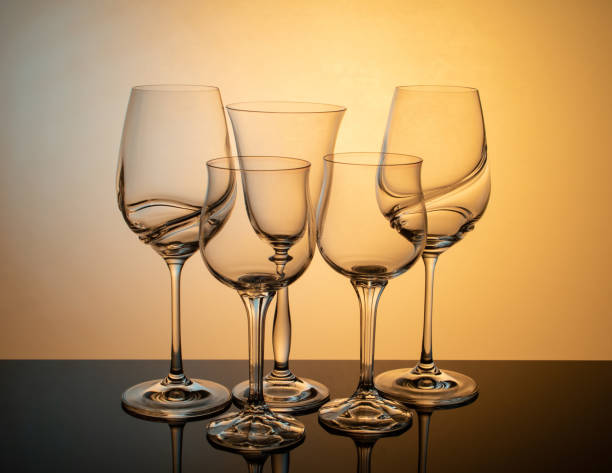istock a group of transparent wine glasses on a colored luminous background 1412192643