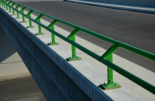istock roof structure or bridge expansion for safe connection of two expandable, pole, concrete bodies. rubber joint in a metal bar, rubber, bridge, railing green, metal 1412193096