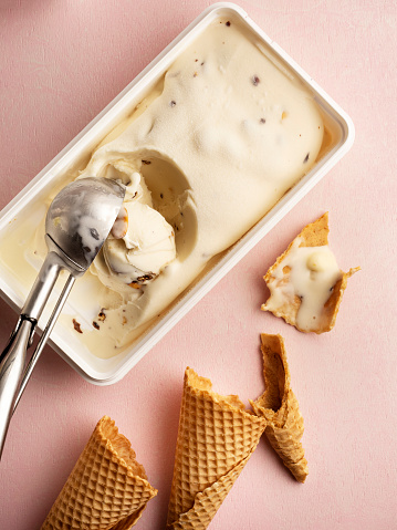 Variety of chocolate ice cream desserts. Overhead view scattered on a dark slate background.