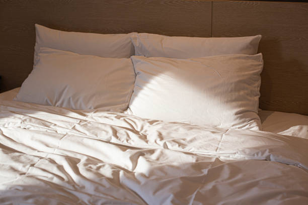 istock Pillow on bed decoration in bedroom interior 1412202123