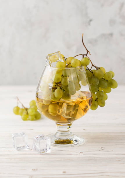 istock red and white grapes with wineglass 1412202427