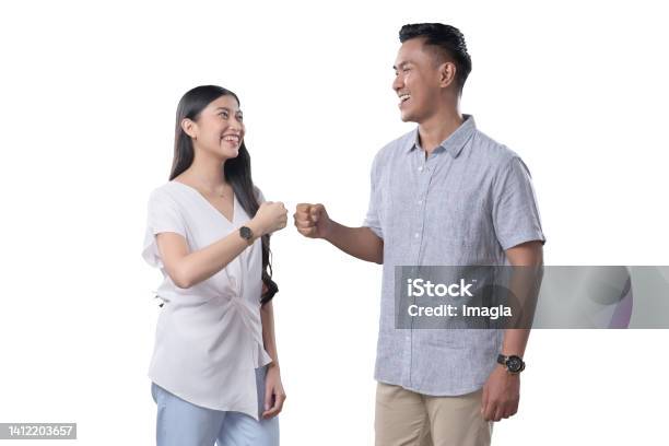 Southeast Asian Couple Fistbump Stock Photo - Download Image Now - Friendship, Southeast Asian Ethnicity, 25-29 Years