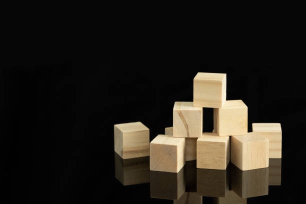 istock wood cube block puzzle on black background 1412205057