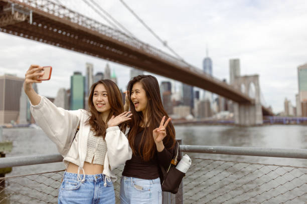 istock Tourist selfie time under the Brooklyn Bridge 1412205082