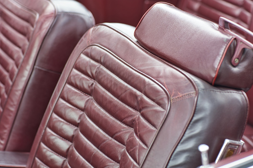 Old red leather driver's seat