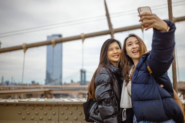 istock Tourist selfie time at Brooklyn Bridge 1412206302