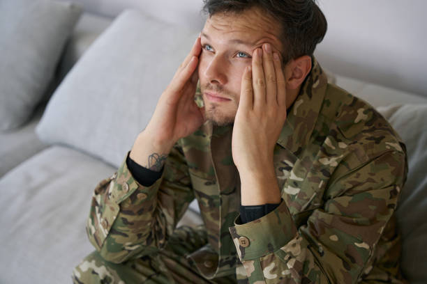 istock Military serviceman at home having post traumatic stress syndrom 1412206433