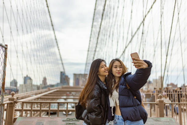 istock Tourist selfie time at Brooklyn Bridge 1412206730