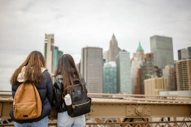 istock Tourist observing Lower Manhattan from the Brooklyn Bridge 1412207098