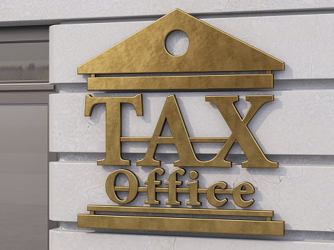 Tax Office Sign on Concrete Wall. 3D Render