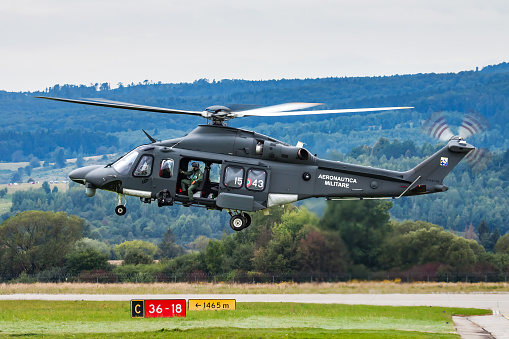 Sliac, Slovakia - August 30, 2014: Military helicopter at air base. Air force flight operation. Aviation and aircraft. Air defense. Military industry. Fly and flying.