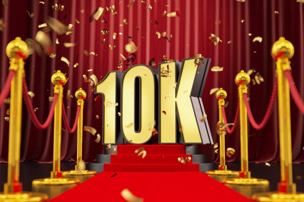 istock 10K Celebration Neon Sign on a Podium with Red Carpet and Confetti 1412209799
