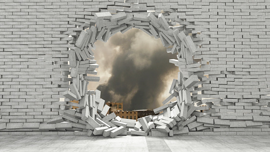 Frame in the shape of a circle window lined with old, aged damaged yellow bricks isolated on a white background.