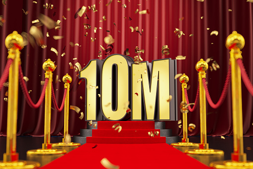 10M Million Celebration Neon Sign on a Podium with Red Carpet and Confetti. 3D Render
