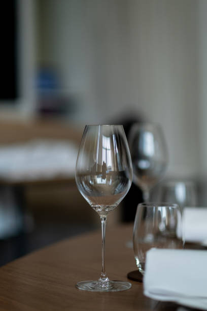 istock empty glass of water on the table with blur background 1412209816