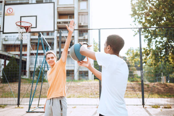 istock Friends playing basketball 1412210470