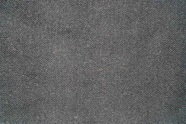 istock Black fabric background. Cotton fabric canvas texture background 1412210476