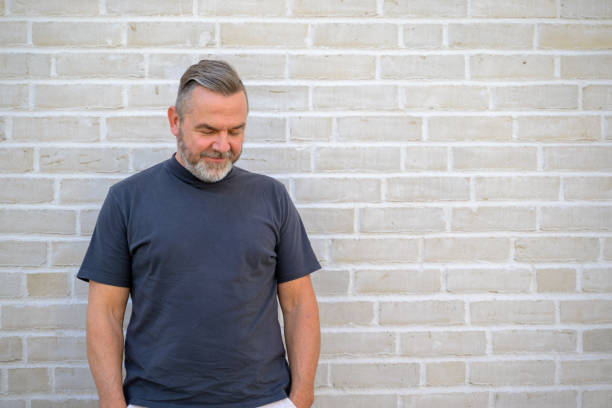istock Thoughful man looking down to the ground 1412211783