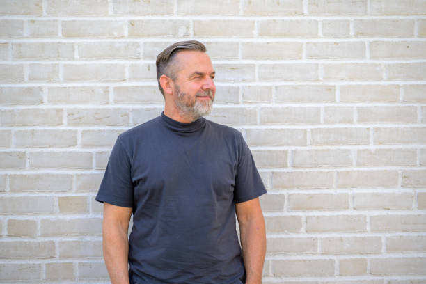 istock Relaxed bearded middle aged man in summer T-shirt 1412211860