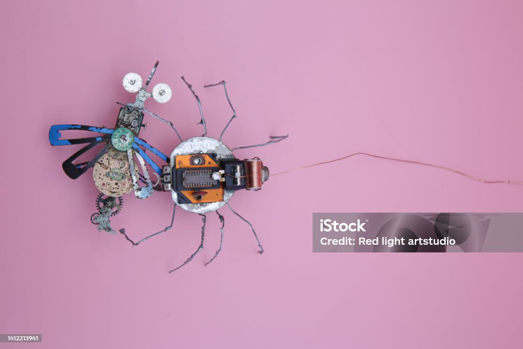 a robot spider attacks a robot fly Animal Stock Photo