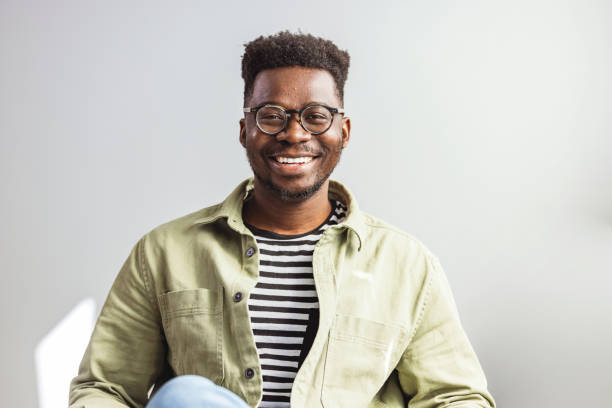 istock Shot of a handsome young man relaxing on the sofa. 1412215791
