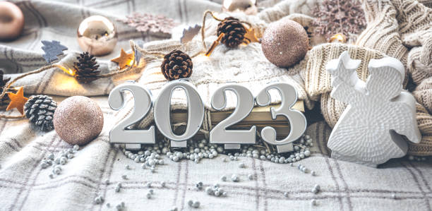 istock Christmas cozy background with numbers 2023 and decor details. 1412217141