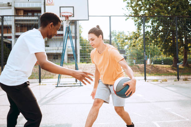 istock Friends playing basketball 1412218343