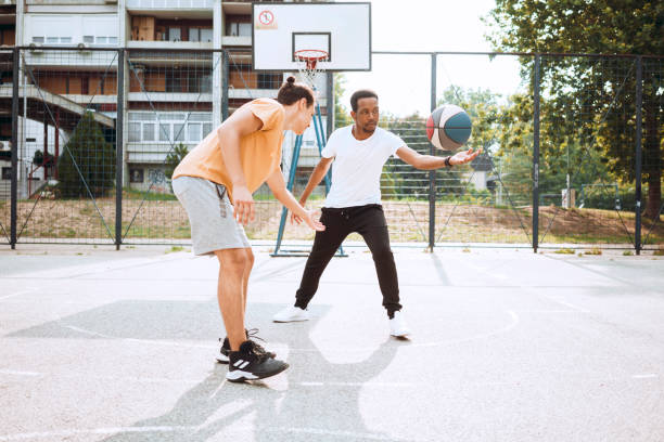 istock Friends playing basketball 1412218358