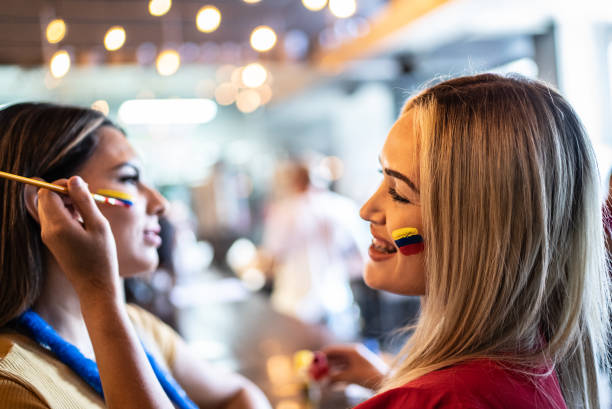istock Friends painting a face at a bar 1412220276