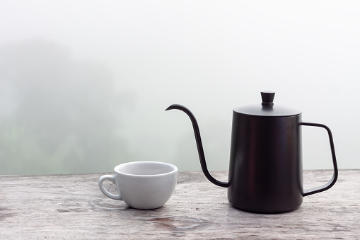 Drip coffee set on wooden table with foggy morning background, Set for make coffee drip