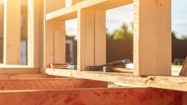 istock Manual tools on wooden plank at cottage construction site 1412222913