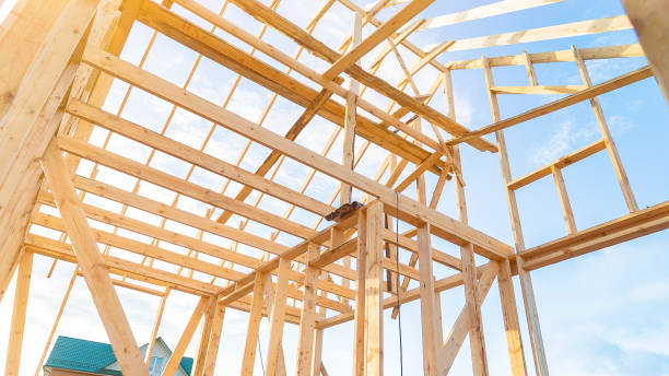 istock Incomplete rural house at construction site under blue sky 1412223067
