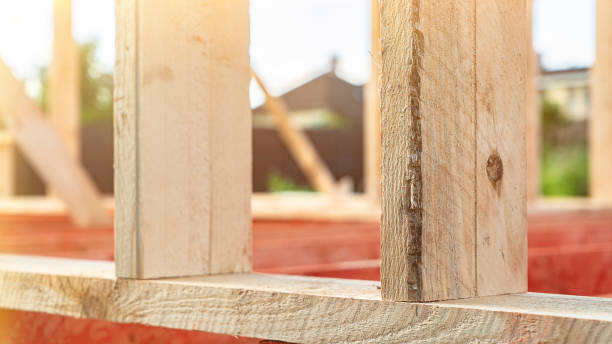 istock Unprocessed wooden plank at ecological construction site 1412223078