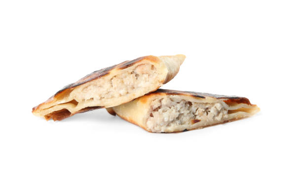 istock Cut fried cheburek isolated on white. Traditional pastry 1412223826