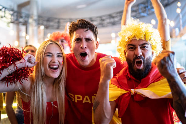 istock Spanish fans watching a soccer game and celebrating at a bar 1412228497